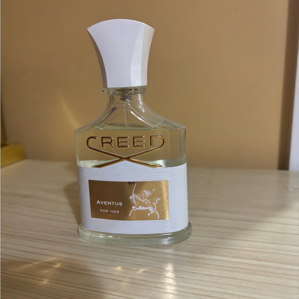 Creed Aventus For Her with Gold and White Accents